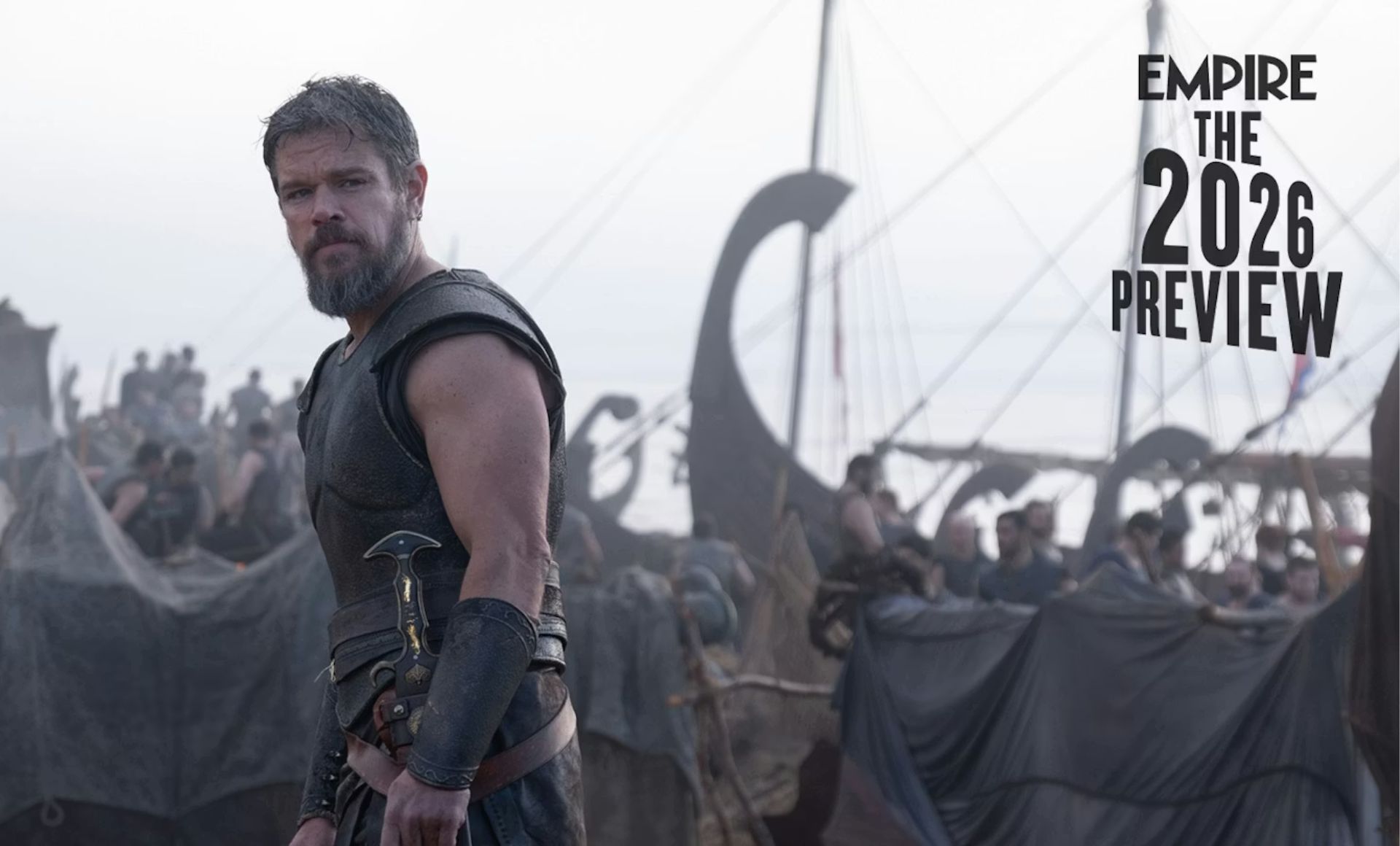 A bearded man in ancient warrior armour stands before ships and soldiers, looking serious. The text reads EMPIRE THE 2026 PREVIEW. Get a glimpse of the epic atmosphere and the Biggest Films 2026 has to offer.
