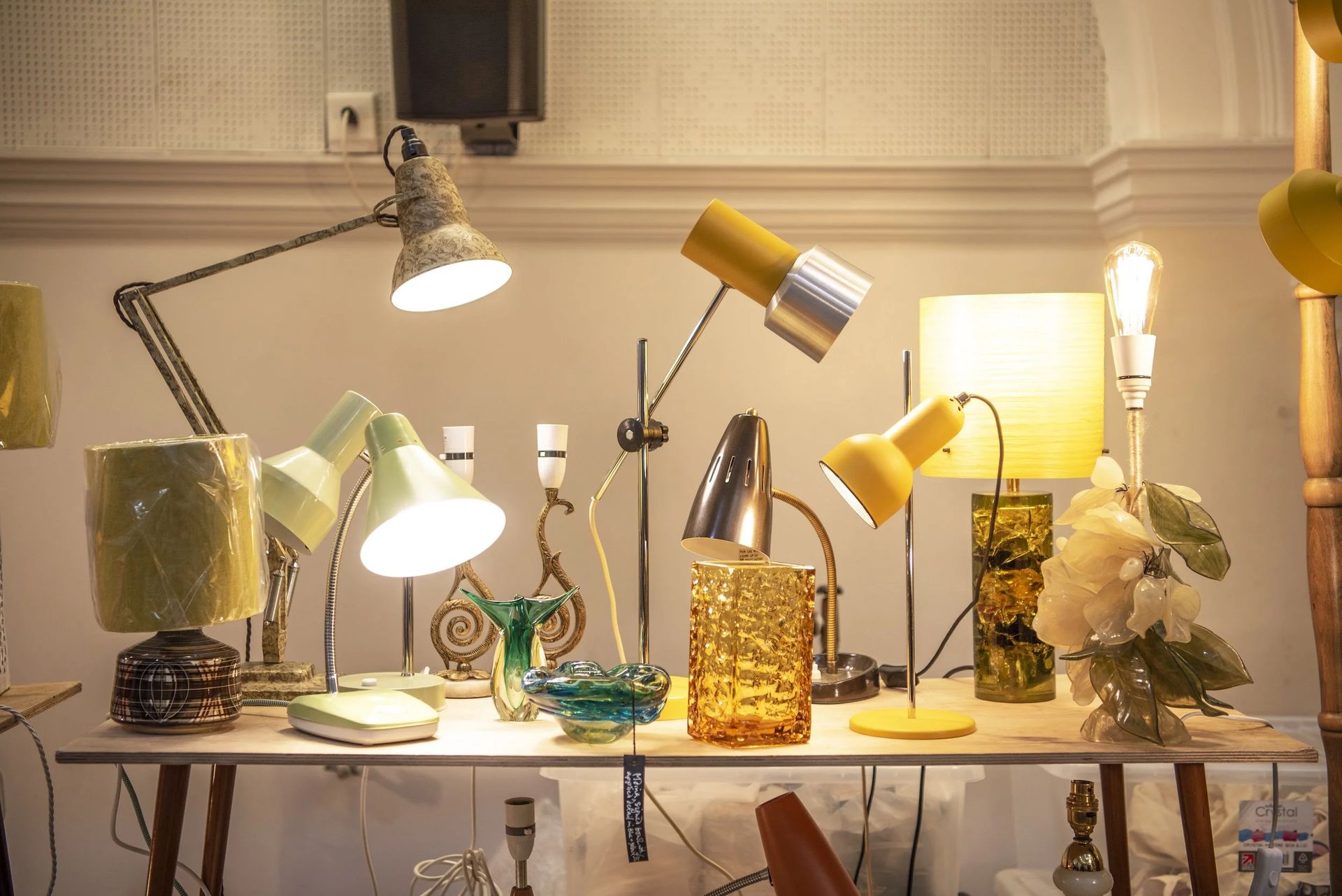 A table with lamps and flowers, perfect for adding vintage charm to your home—discover similar finds in our flea market guide to London shopping.