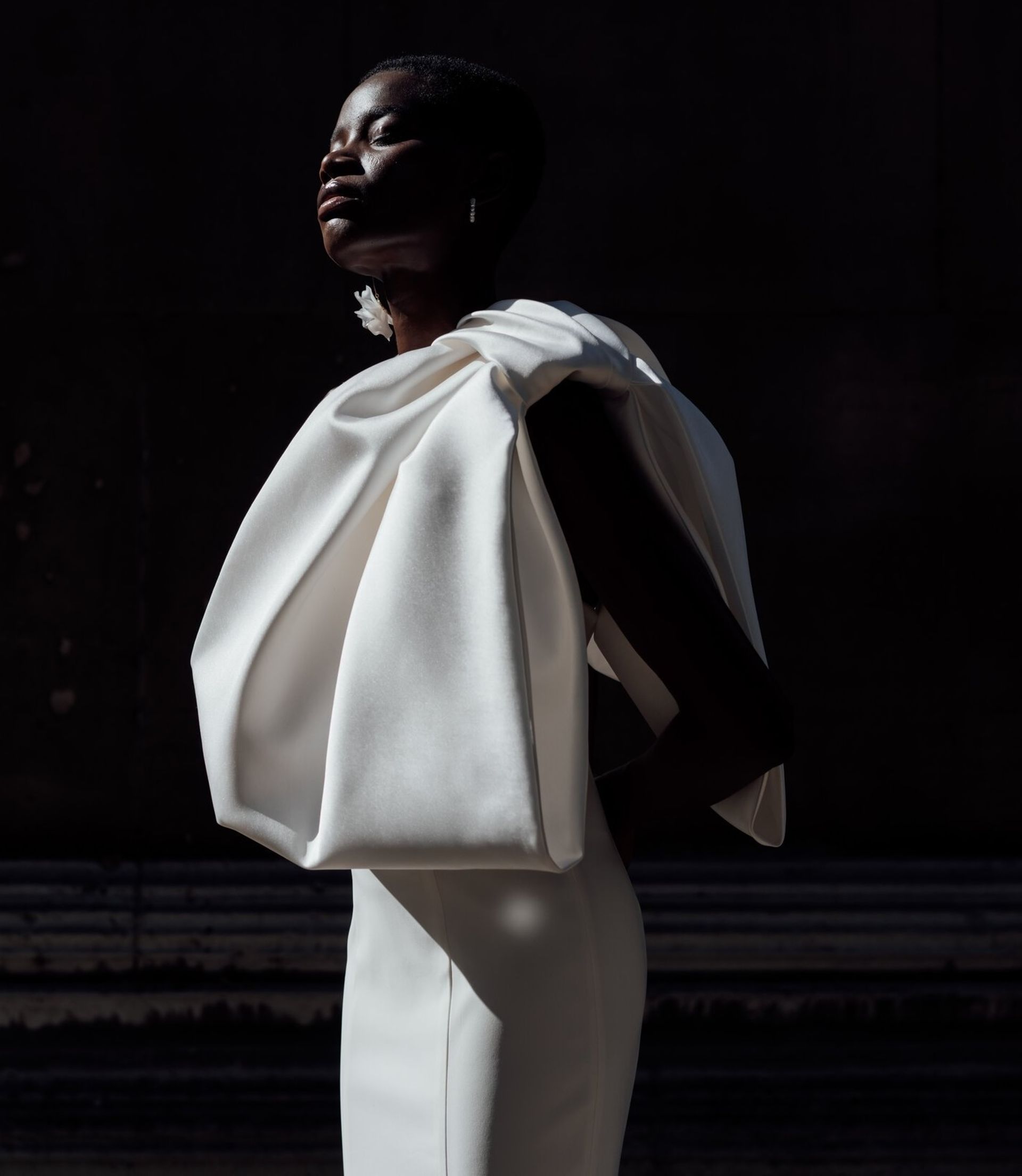 model wearing oversized bow dress 