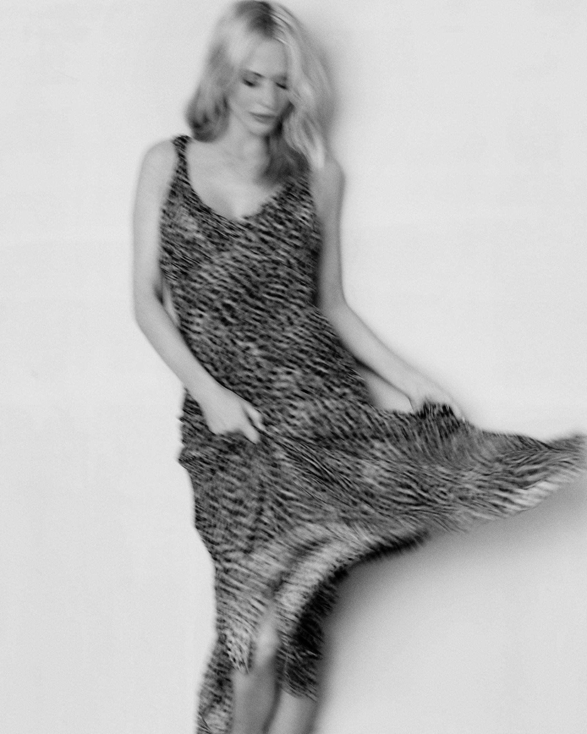 poppy in leopard dress in black and white