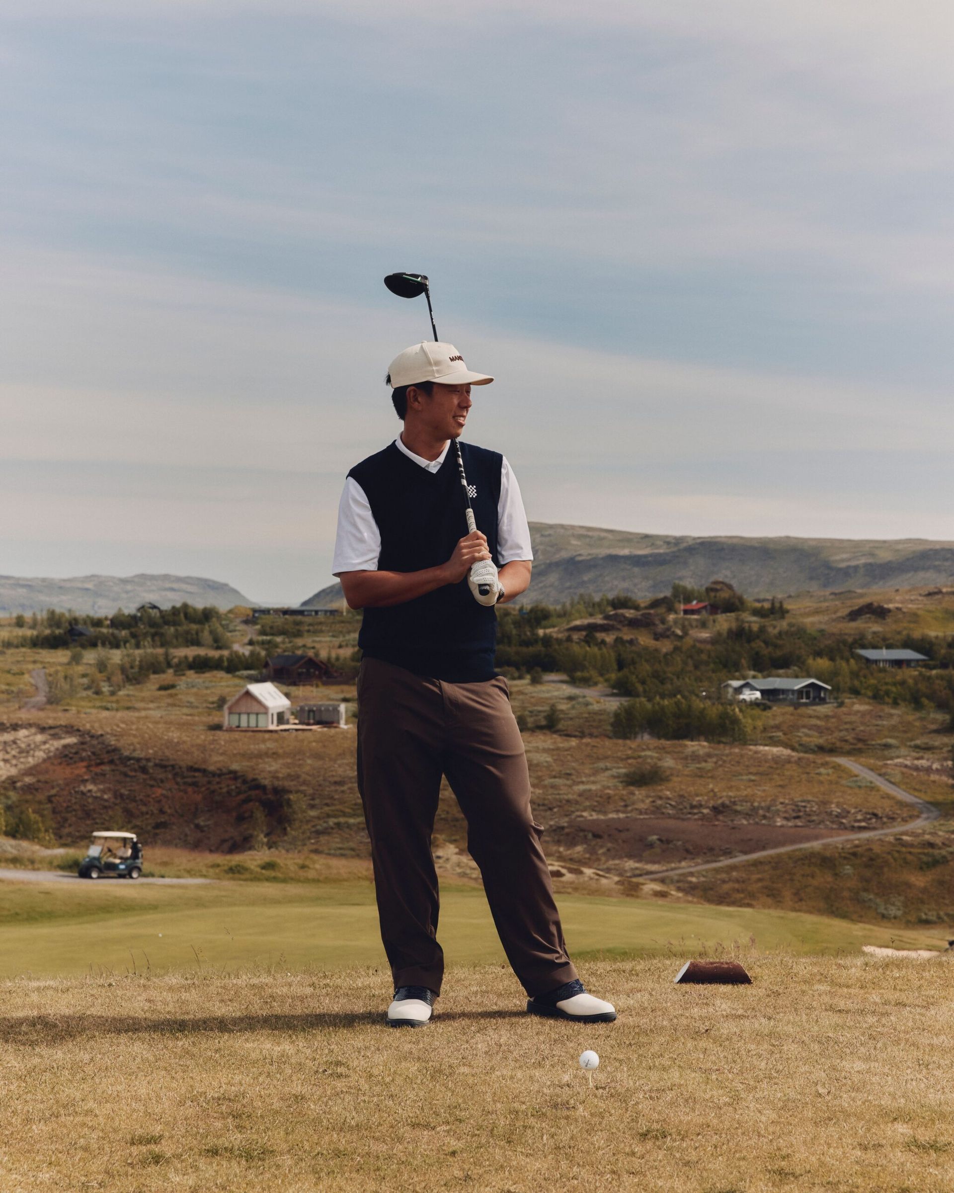 MALE MODEL ON GOLF COURSE FOR MANORS BRAND