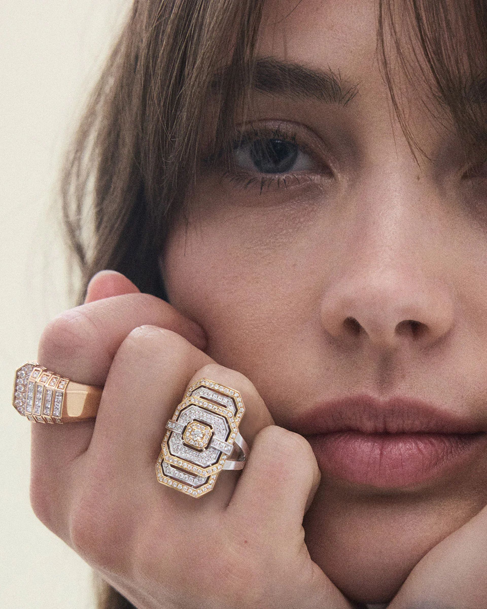close up of model wearing statement ring 