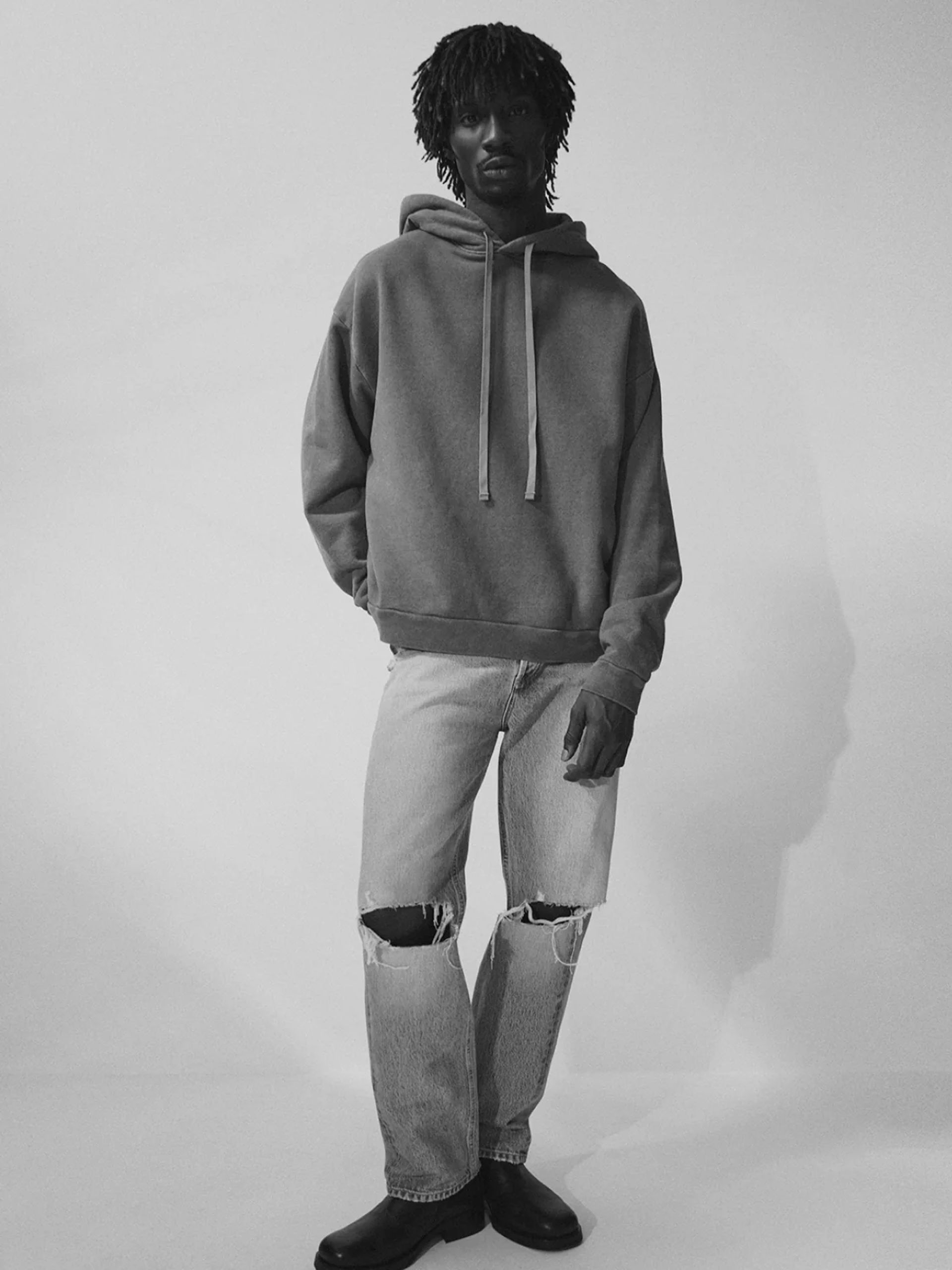 model wearing hoodie and jeans