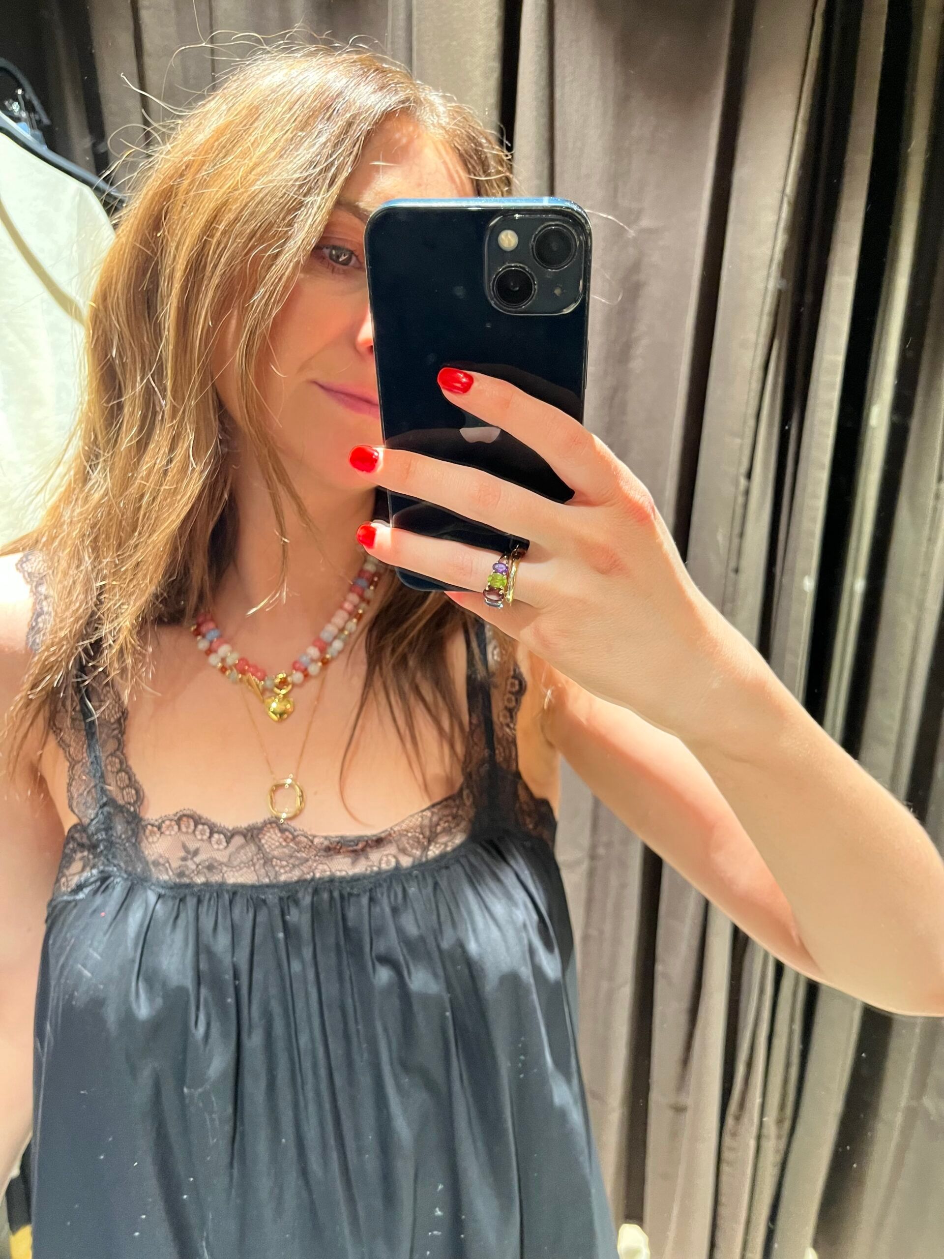 Astrid wearing black lace trimmed dress