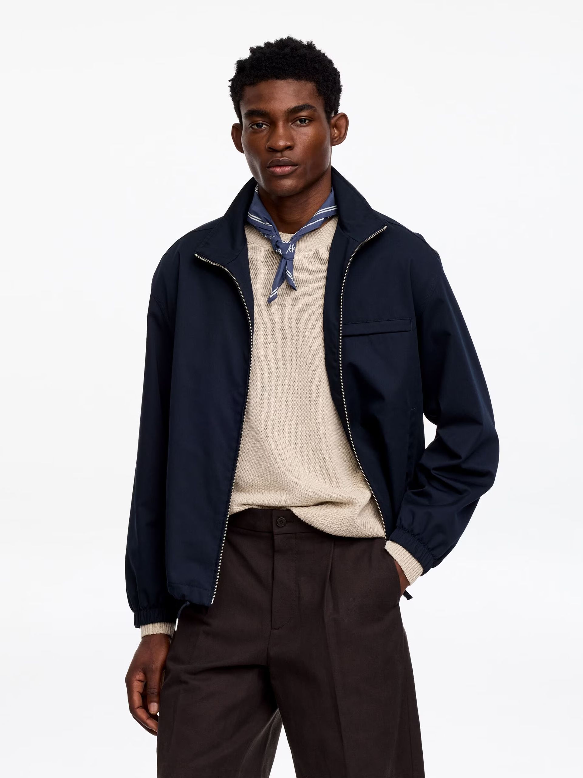 male model wearing navy neckerchief and navy jacket