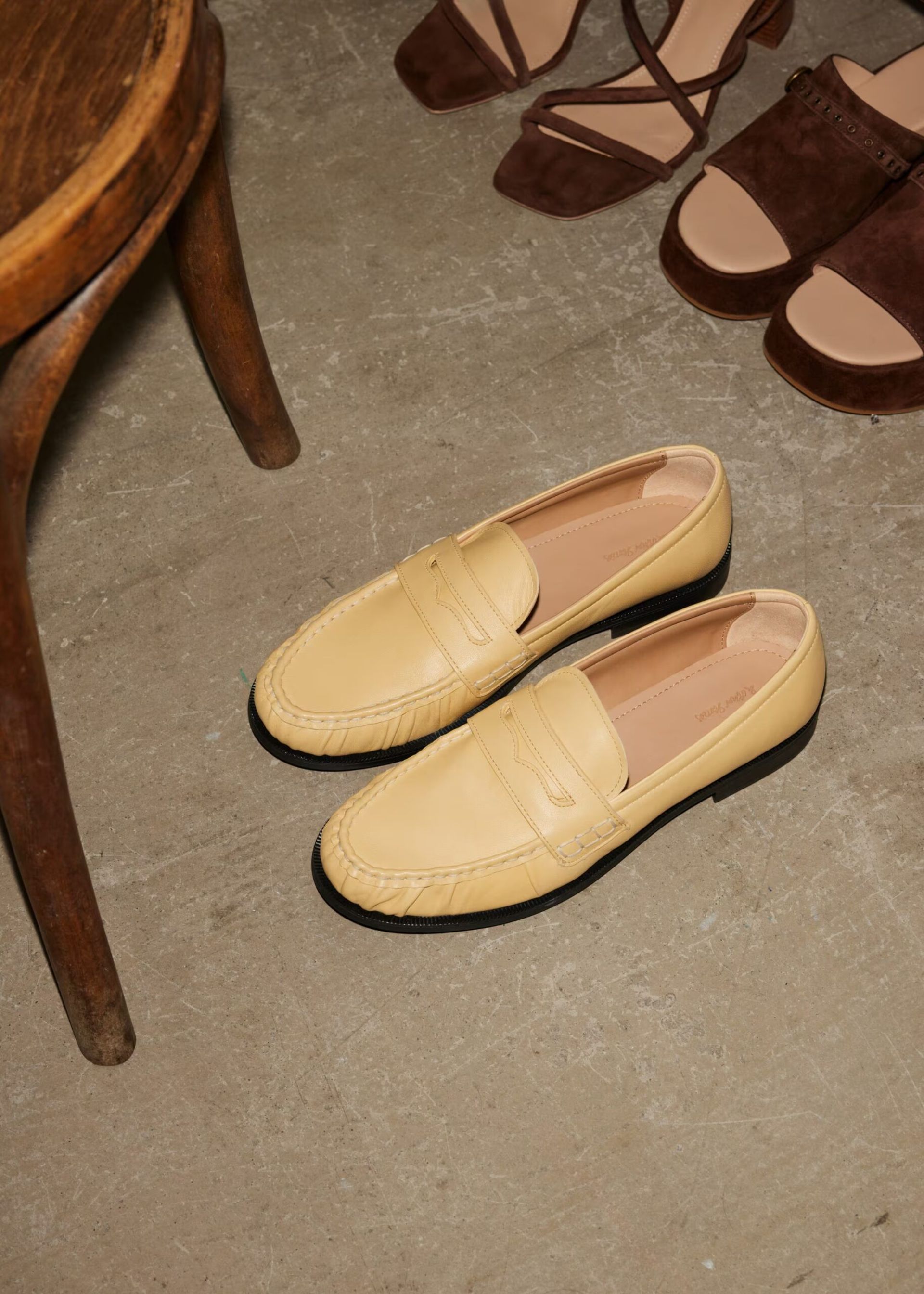 yellow loafers on floor
