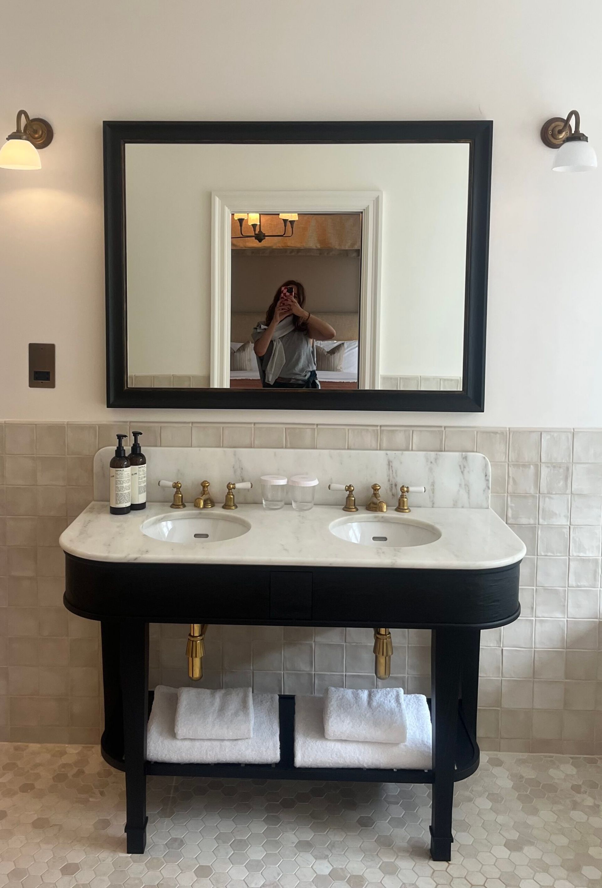 astrid in mirror of bathroom
