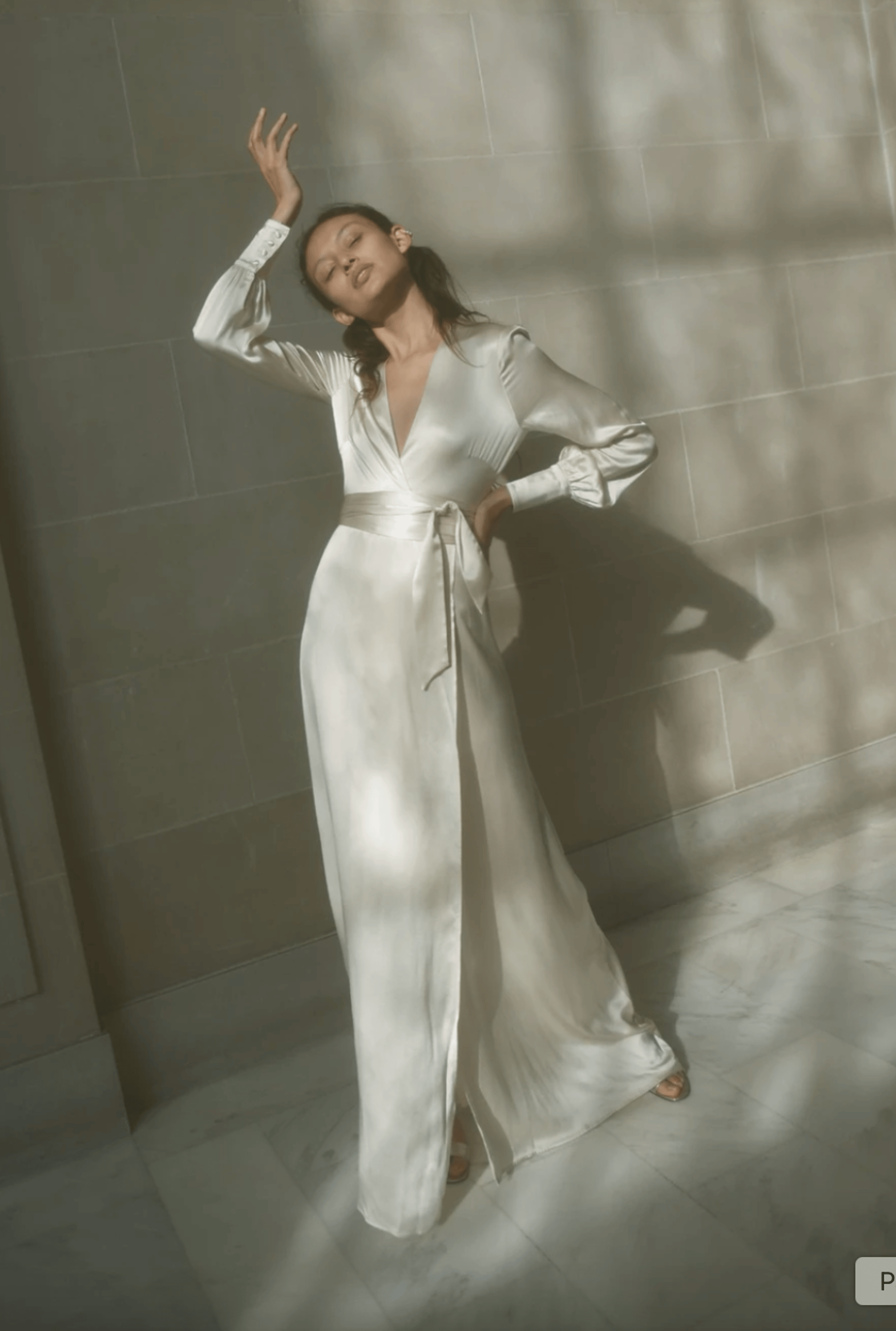 model wearing ivory wedding gown 