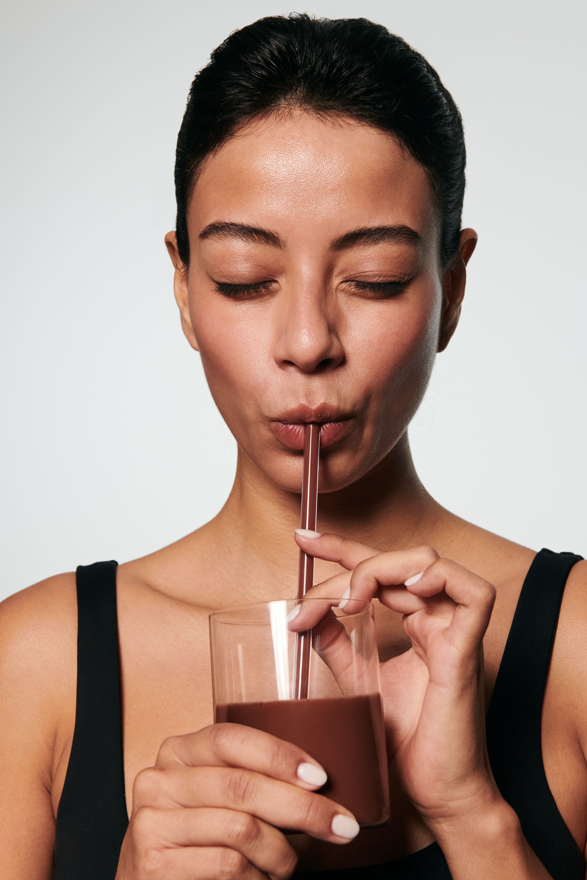 model drinking Indi smoothie drink