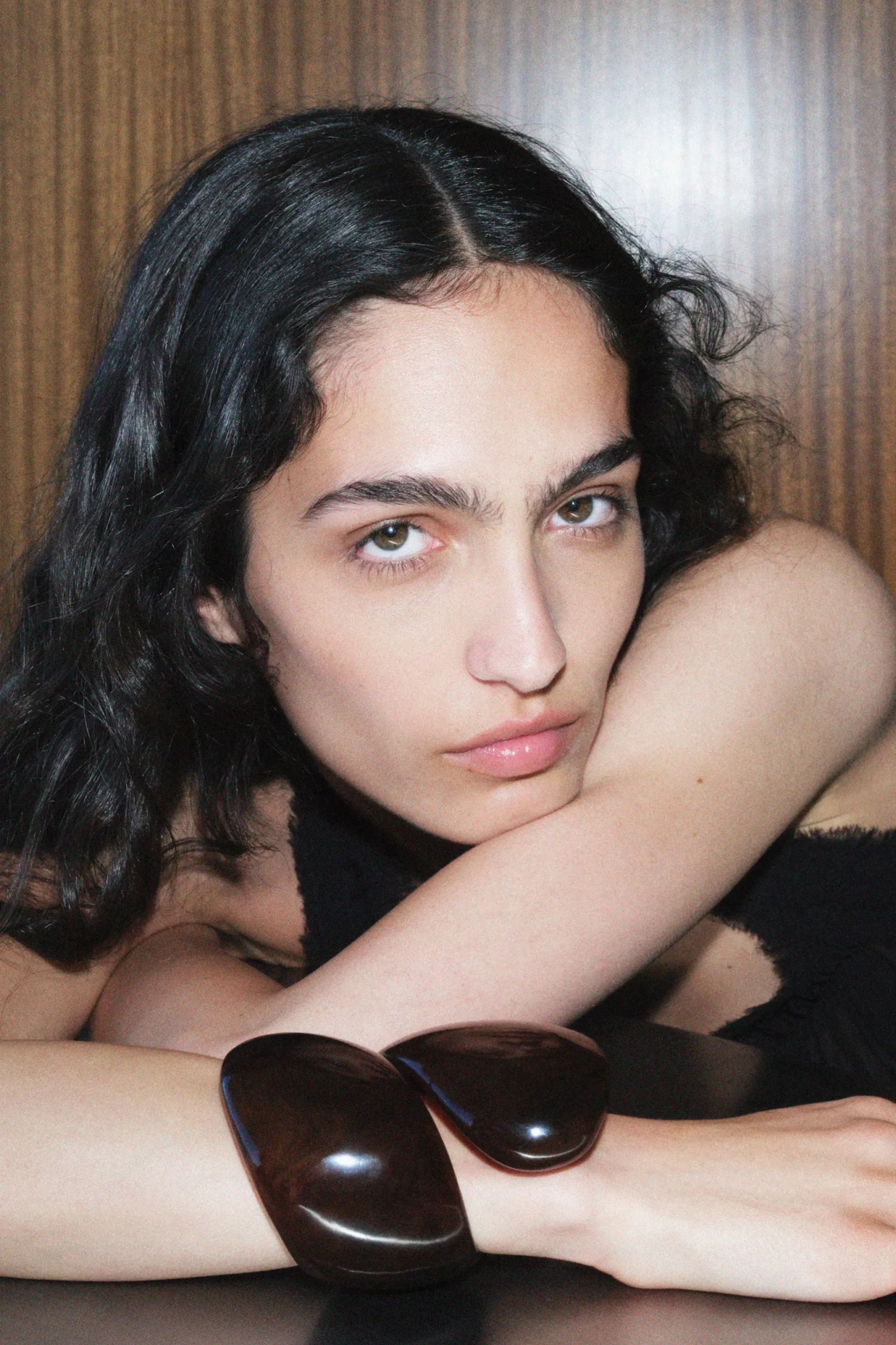 model wearing zara arm cuff