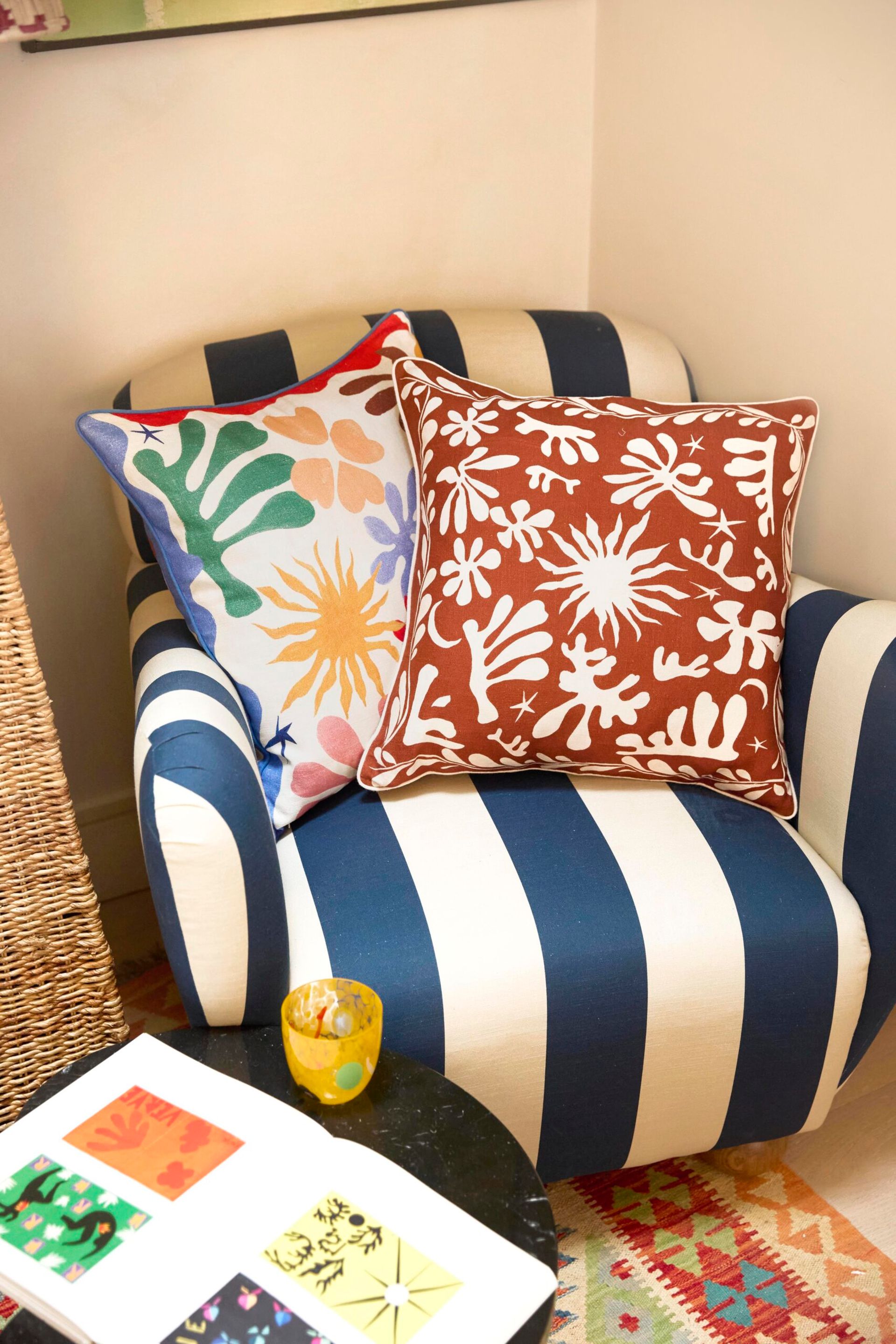 striped chair with rixo print cushions
