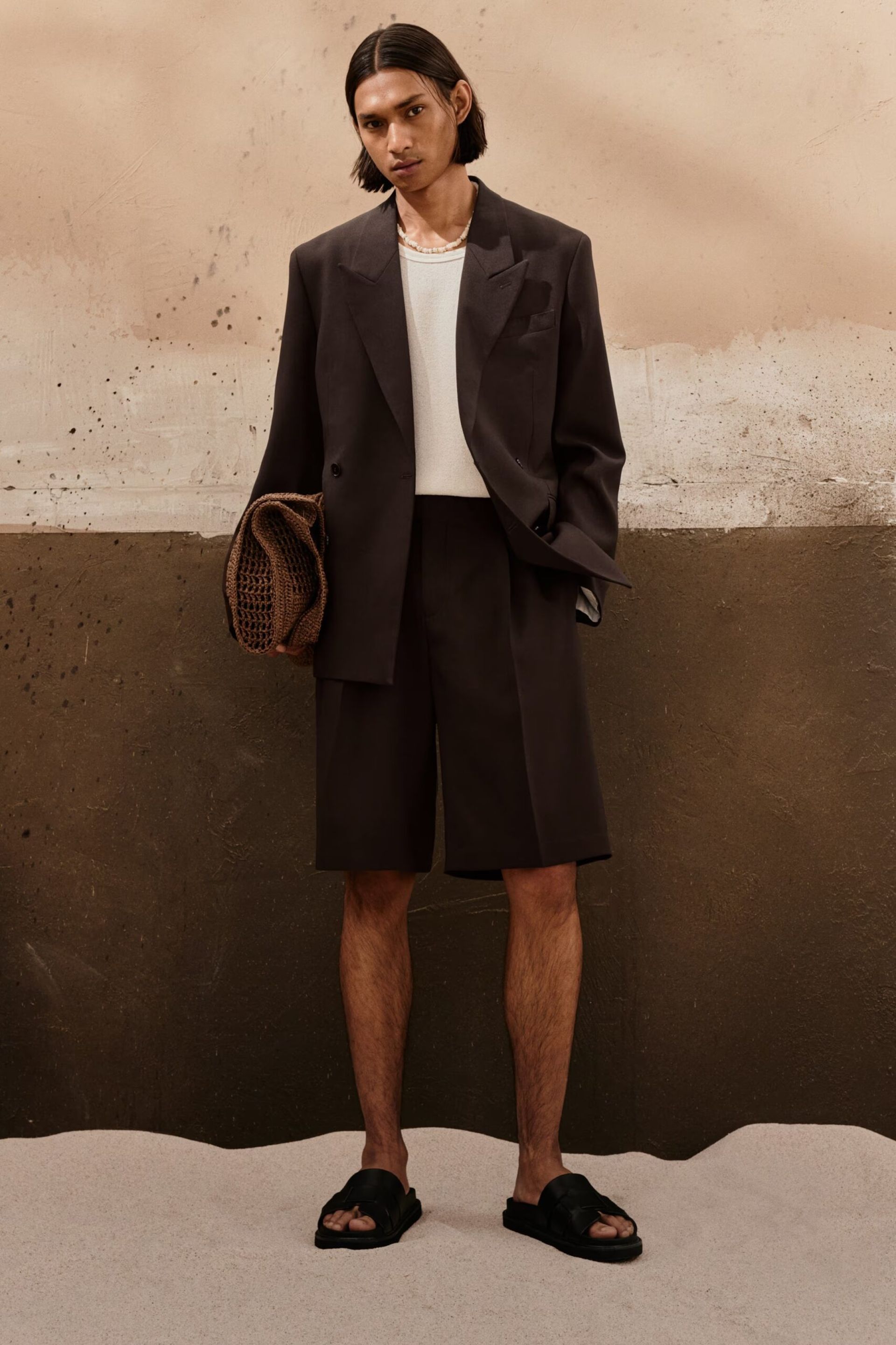 MALE MODEL IN BROWN shorts suit 