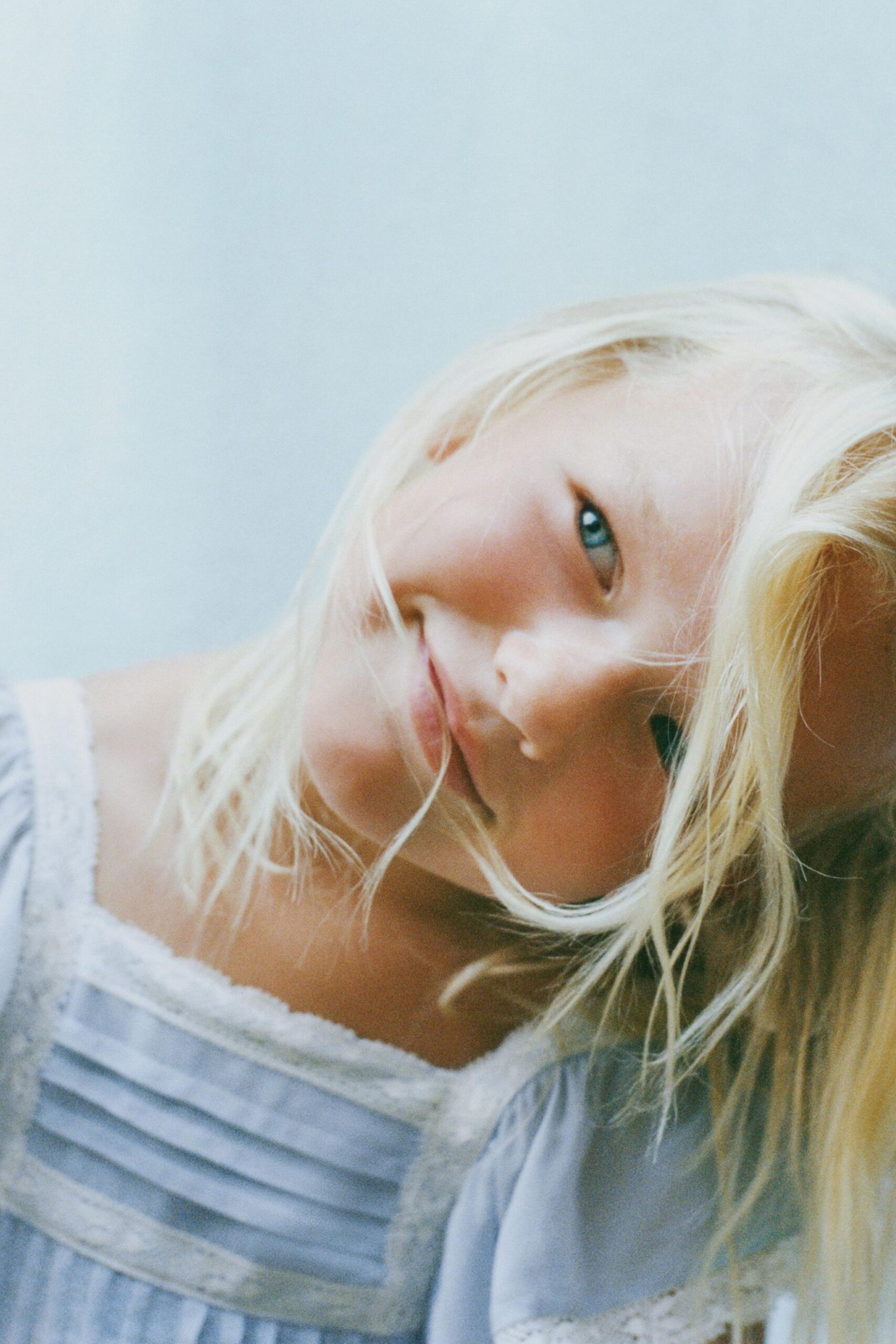little girl close up wearing blue dress 