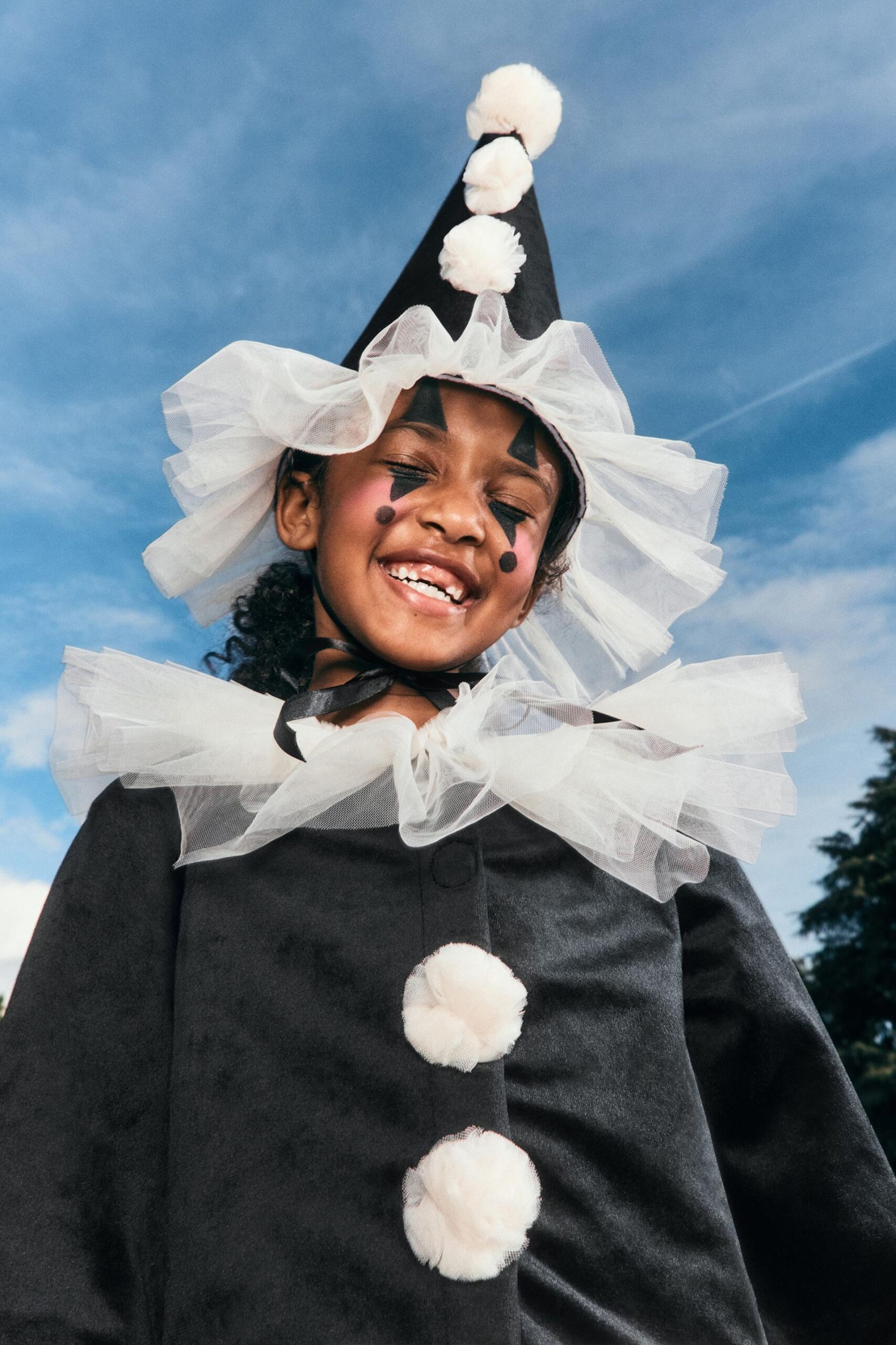 little girl in clown costume