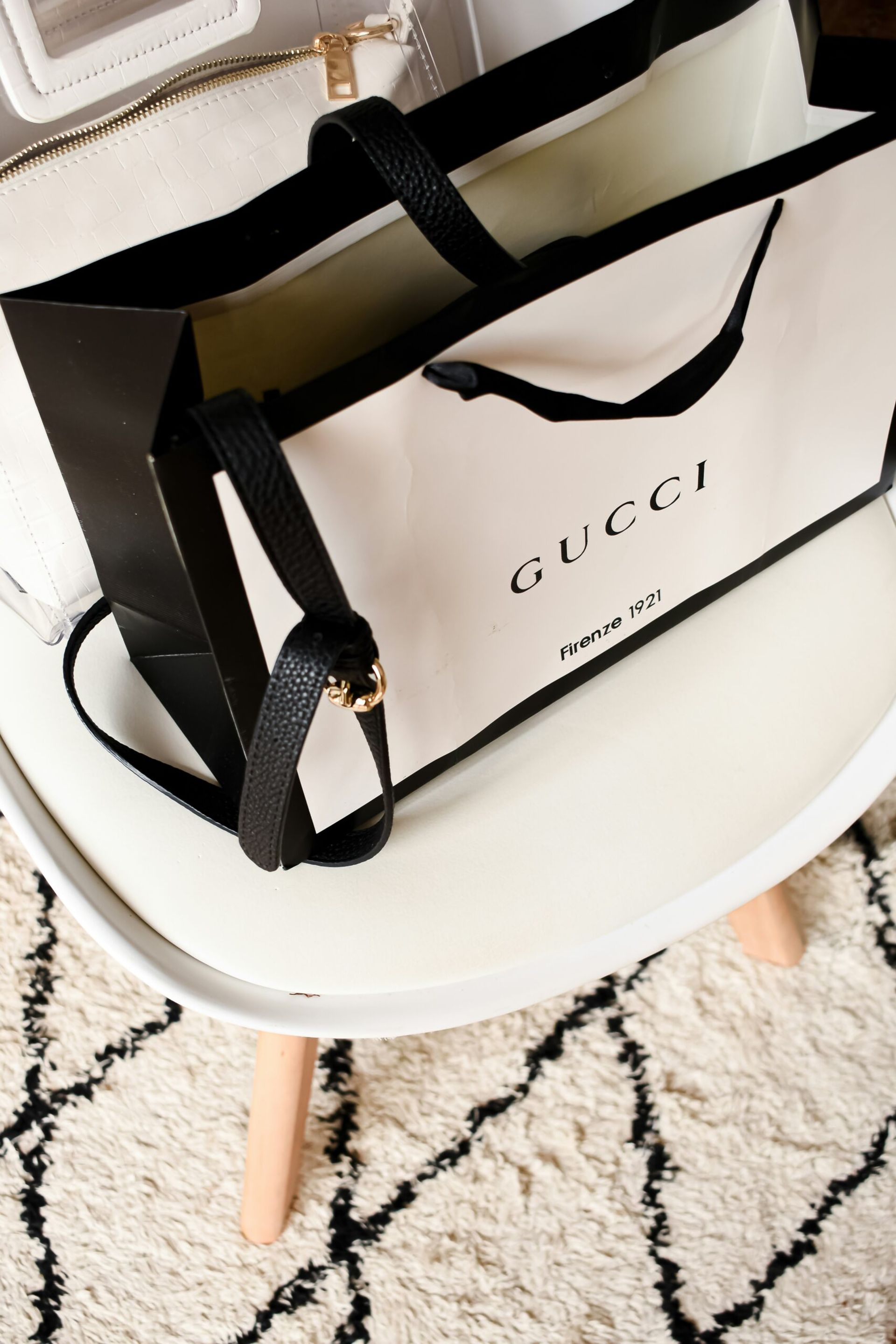 gucci shopping bag on stool