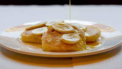 Balthazar - New York Pancakes with fresh banana and Canadian maple syrup 1 by Sim Canetty-Clarke - Copy