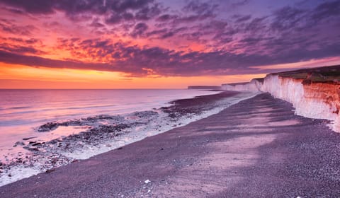 Sunset over the chalk cliffs of Birling Gap on the south coast of England