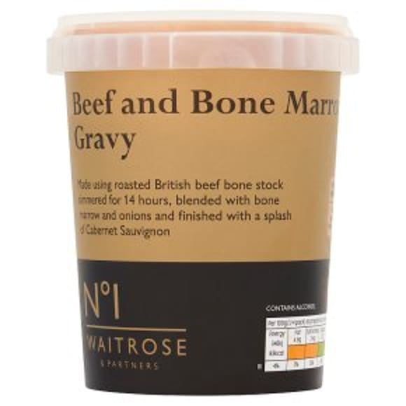 A tub of Waitrose No.1 Beef and Bone Marrow Gravy with a brown label detailing its ingredients and nutritional information on the front—perfect for Easter entertaining.