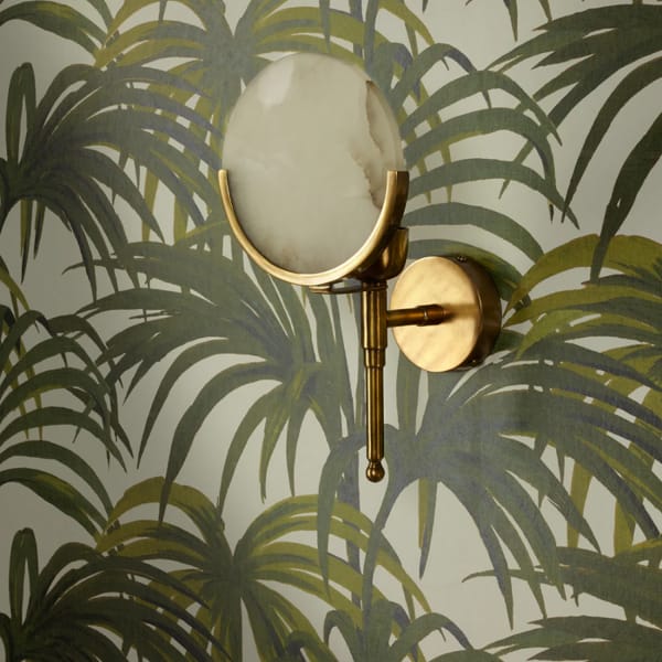 firefly wall light in antique brass with an alabaster globe