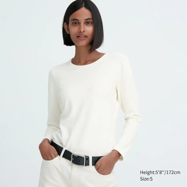 model wears cream HEATTECH ULTRA WARM CREW NECK LONG SLEEVED THERMAL TOP