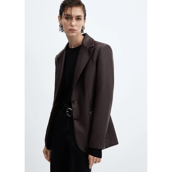 model wears brown leather jacket