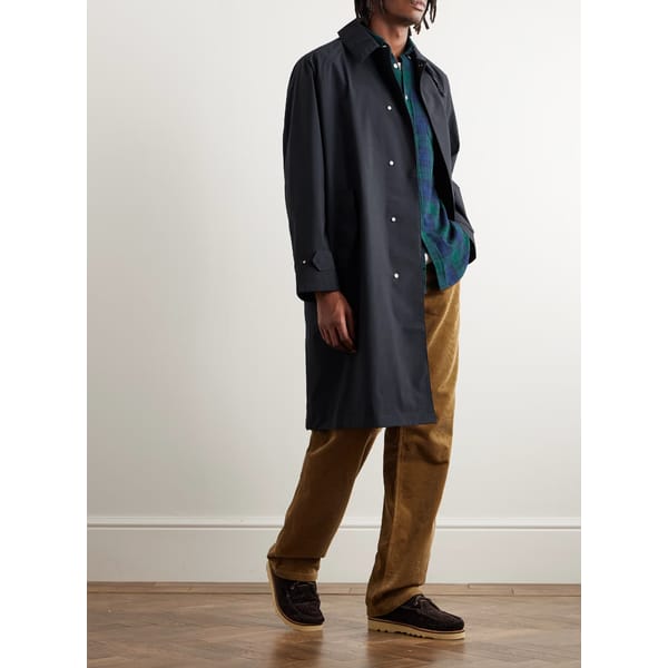 model wears navy trench coat