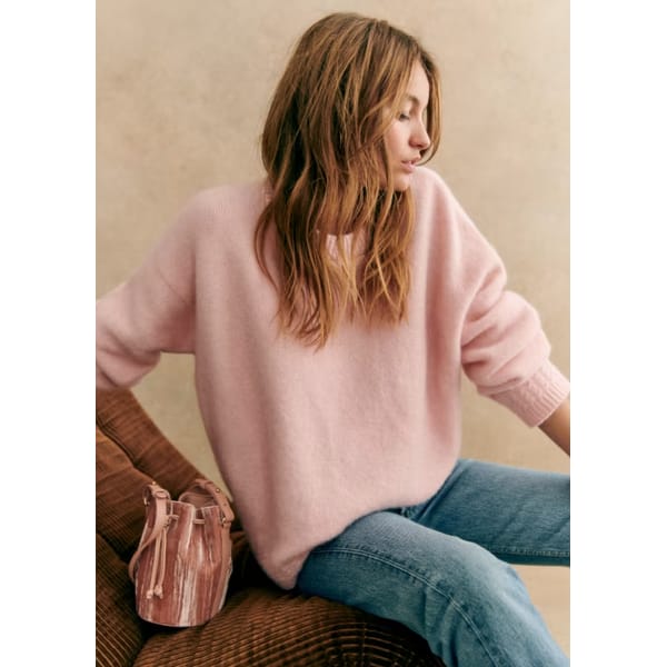 model wears pink sezane AMIEL JUMPER