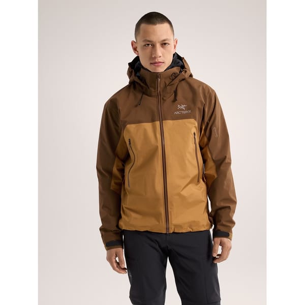 model wears yellow and brown jacket