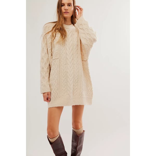 model wears cable knit cream dress