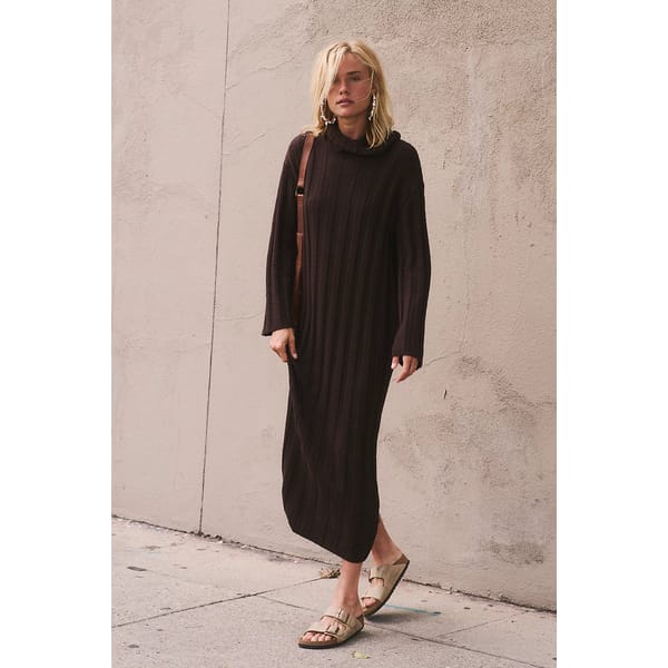model wears brown knitted dress