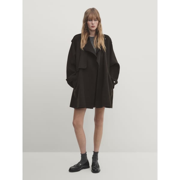 model wears trench coat