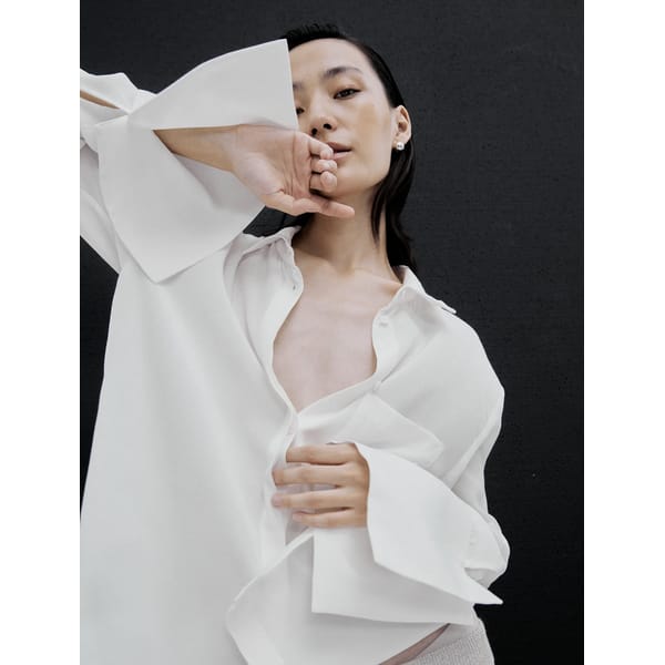 model wears white shirt