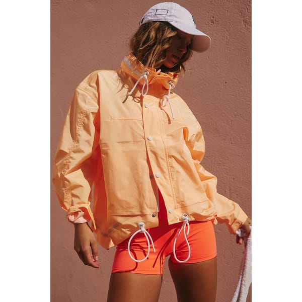model wears orange sports jacket