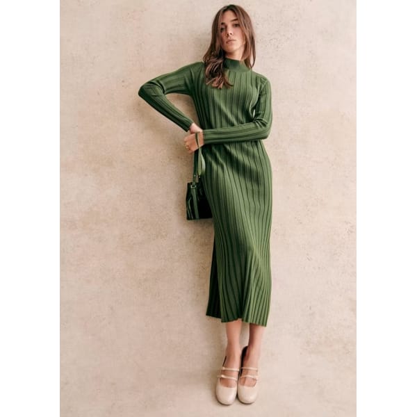 model wears green ribbed midi dress