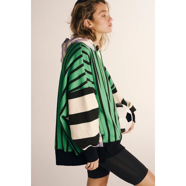 model wears green, black and white print hoodie