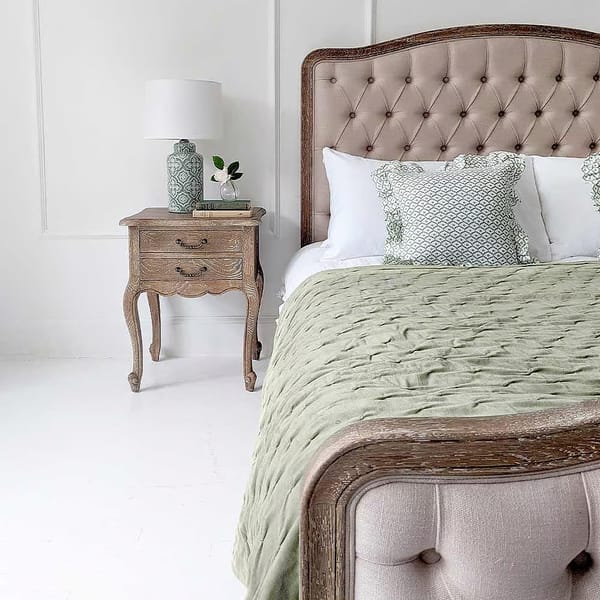 bedroom with green bed spread