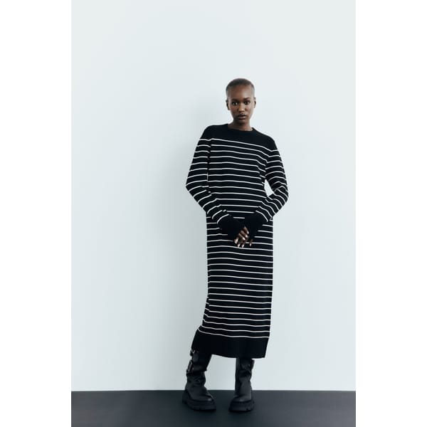model wears breton striped dress