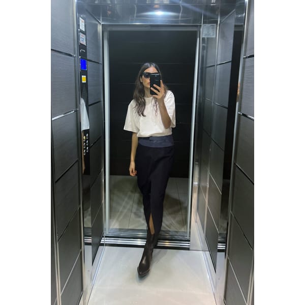 woman taking selfie in mirror