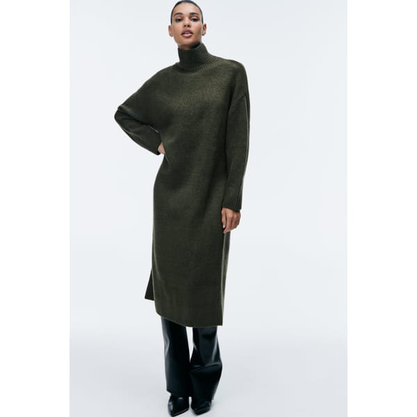 model wears soft grey knitted dress
