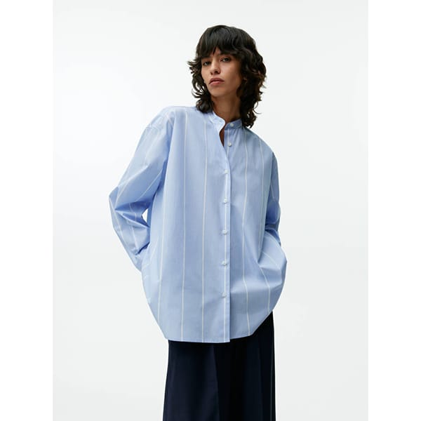 model wears blue stripe shirt