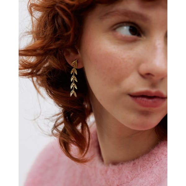 model close up wearing Leaf Gold Plated Drop Earrings
