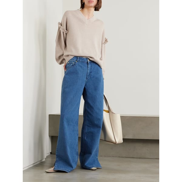 model wears blue jeans
