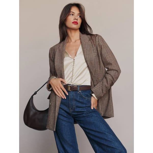 model wears brown check blazer
