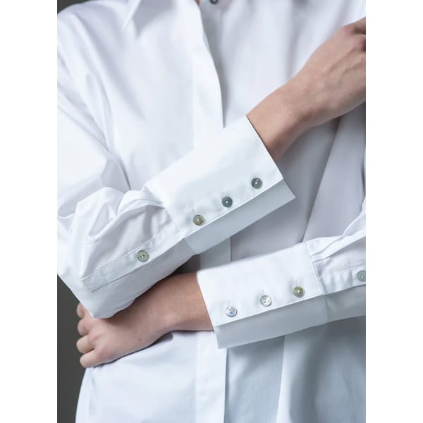 close up of women's white shirt sleeves