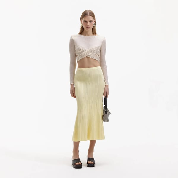 model wears SELF-PORTRAIT CREAM BEADED MESH TOP
