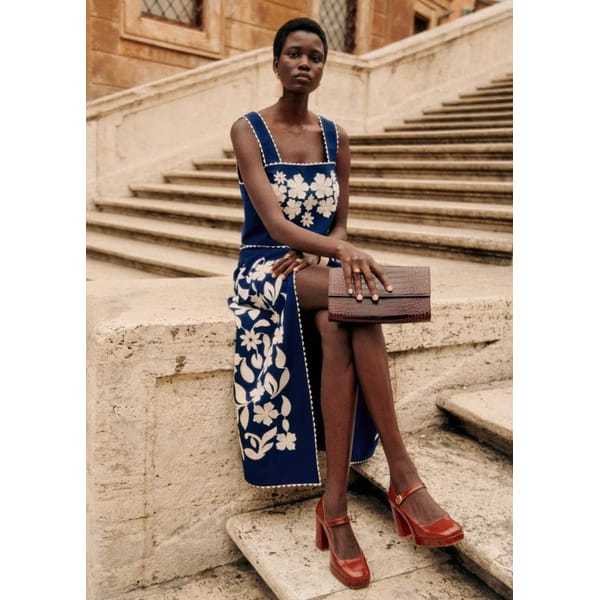 model wears MARGA TOP Blue with ecru embroidery and skirt