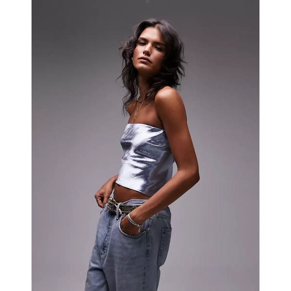 model wears Topshop bandeau top in pale blue
