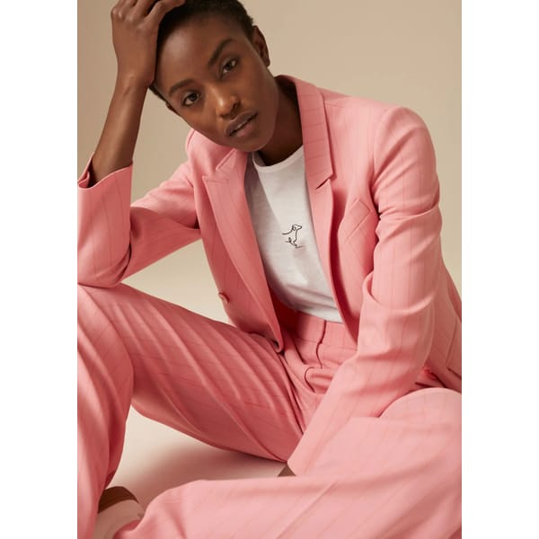 model wears pink suit