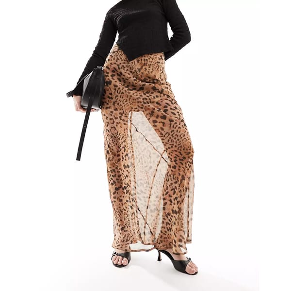 model wears sheer maxi skirt in leopard print