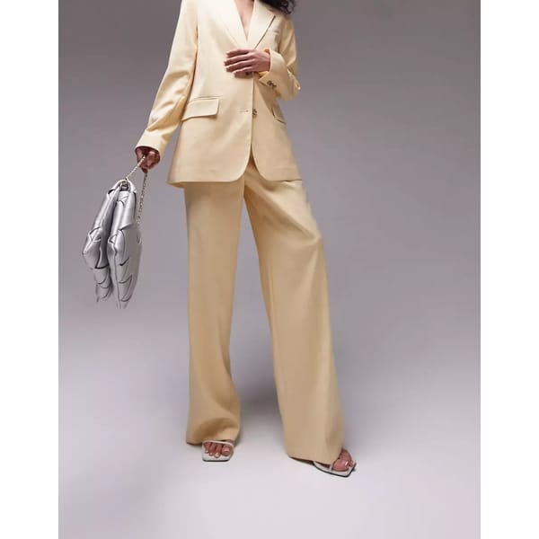 model in yellow trousers